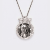 The front side of CRNCY's regular size Angel Photo Pendant with a silver finish. The front side features prong-set diamonds around the photo, angel, and bale. The front side shows the customer's photo selection.