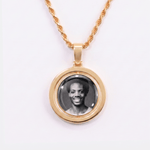 Back side of CRNCY's Double Sided Photo Pendant with a 14k gold finish. The backside has a polished finish without diamonds, allowing the pendant to be worn in a reversibly. The backside shows the back side photo choice.