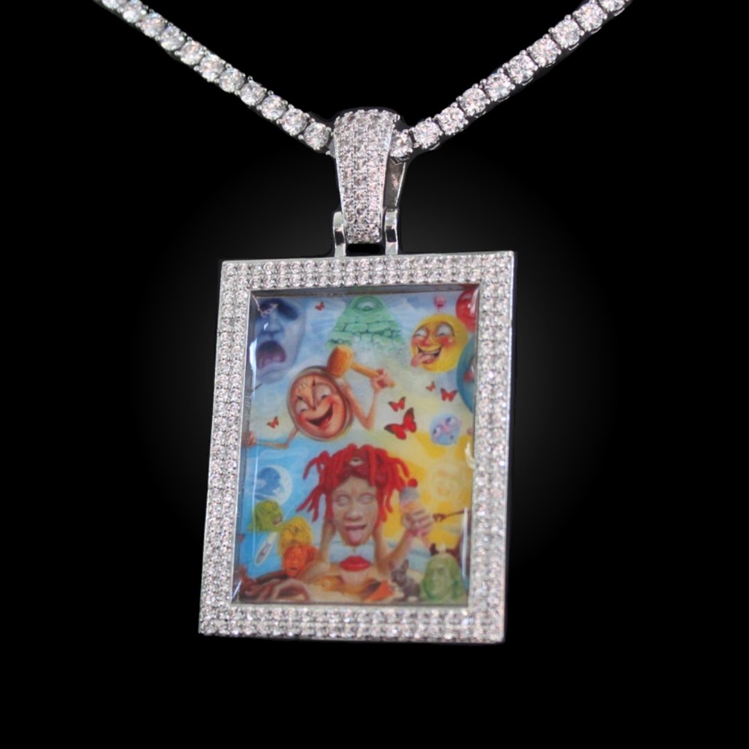 The front side of CRNCY's Large Framed Photo Pendant with a silver finish. The front side features prong-set diamonds around the photo and on the bale. The front side shows the customer's photo choice.