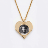 The back side of CRNCY's Father Heart Photo Pendant. The back side has a polished appearance with a circular photo place directly in the center. The photo is selected by the customer.