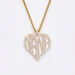 The front side of CRNCY's Nana Heart Photo Pendant with a 14k gold finish and white jewelry enamel. The front side features prong-set diamonds placed inside each letter, surrounded by colored jewelry enamel to outline the letters. 