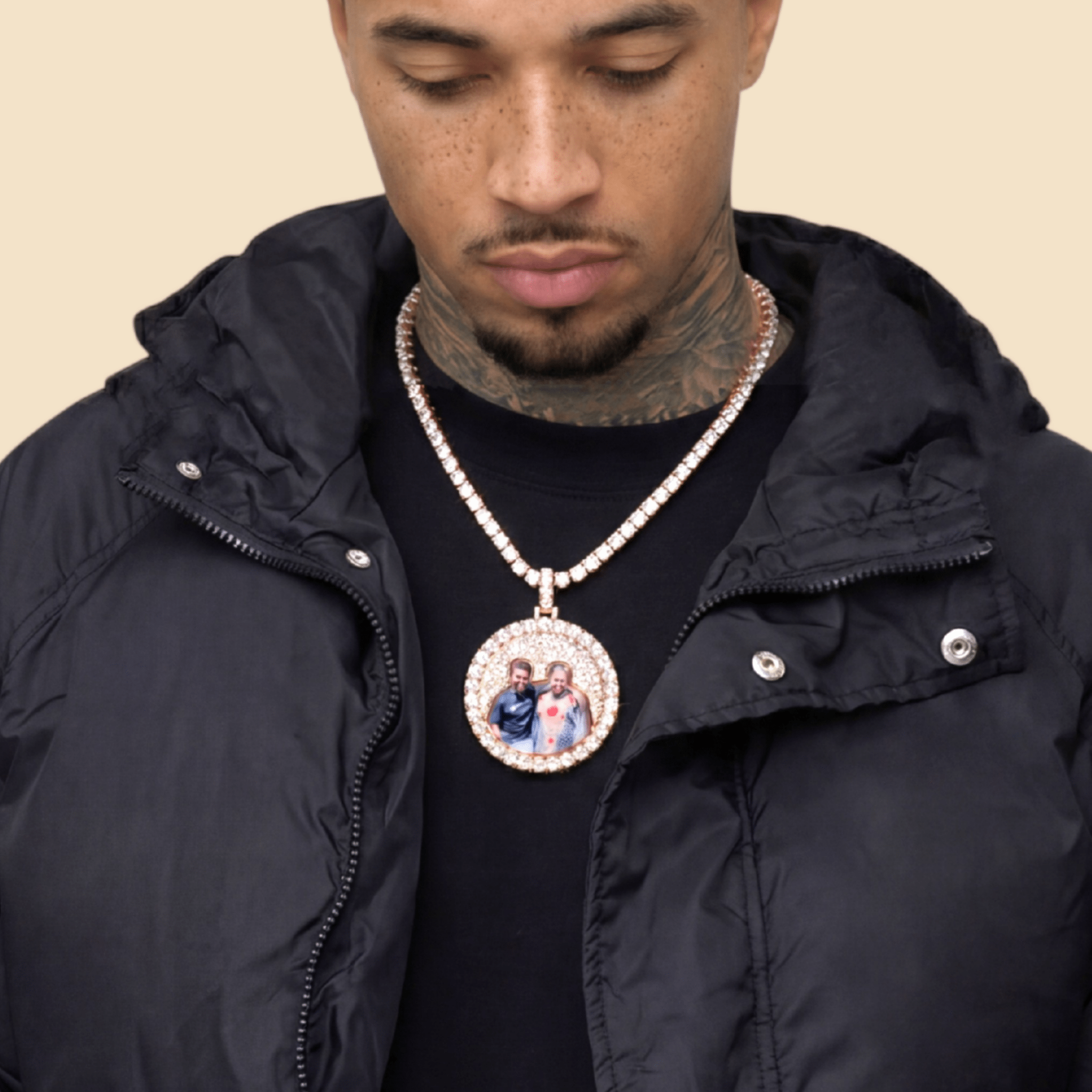 Male model wearing CRNCY's Iced Silhouette Photo Pendant in a rose gold finish, with a 20 inch 5MM Tennis Necklace.