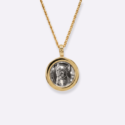 The front side of CRNCY's Mini Photo Pendant with a 14k gold finish. The front side features a polished appearance around the photo and on the bale. The front side shows the customer's photo selection.