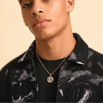 Male model wearing CRNCY's Mini Photo Pendant with a 14k Gold Finish, with a 18 inch length necklace.