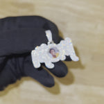Close-up video of CRNCY's MOM Photo Pendant in a silver finish. The video shows the details and shine of the diamonds.