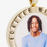Close-up image of CRNCY's Forever With Me Photo Pendant. Focusing on the engraved words on the top of the photo pendant.