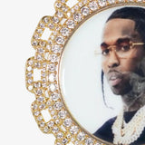 Close-up photo of the front side of CRNCY's Regular size Link Photo Pendant with a 14k gold finish. The front side features prong-set diamonds around the photo and on the bale. The front side shows the customer's photo selection.