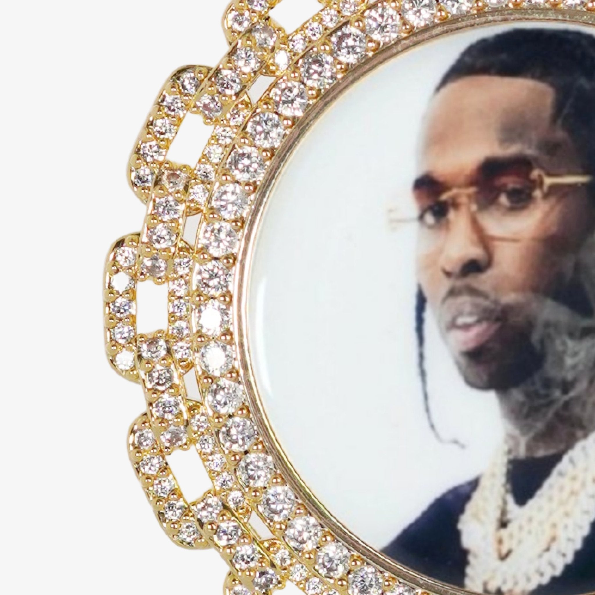 Close-up photo of the front side of CRNCY's Regular size Link Photo Pendant with a 14k gold finish. The front side features prong-set diamonds around the photo and on the bale. The front side shows the customer's photo selection.